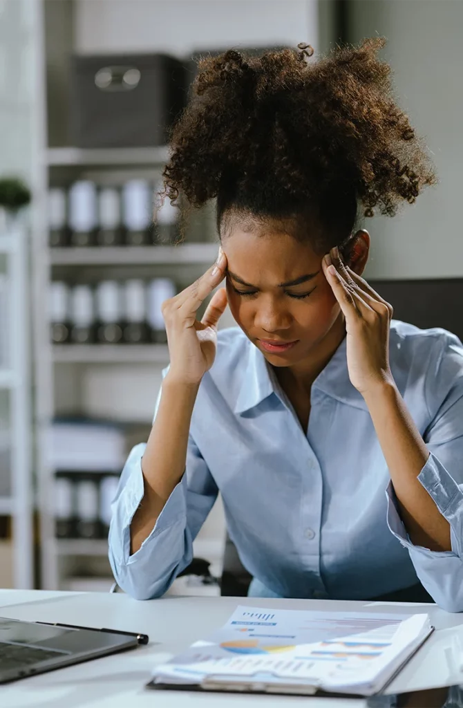 woman at work with a headache